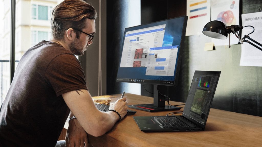 Person sitting at desk with ThinkPad X1 Extreme Gen 4 hooked up to an external monitor