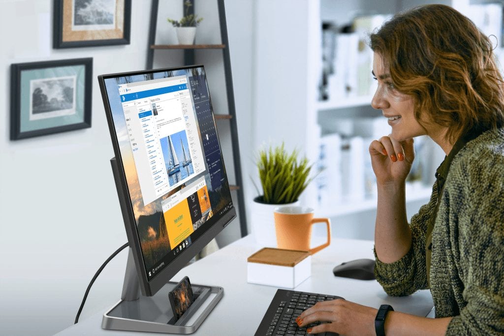 Profile shot of person sitting at the Lenovo L24i-30