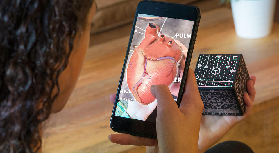 Student using Merge Cube AR