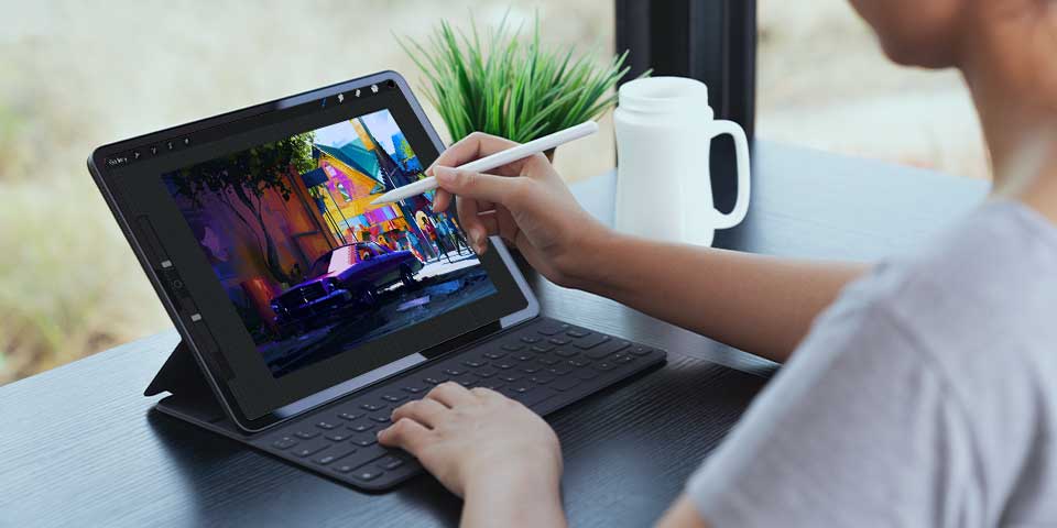 Person drawing on iPad with Procreate app