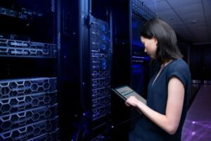 Woman working in data center. 