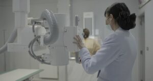 Radiology technician at Ramkhamhaeng Hospital in Thailand prepares an imaging scan. 