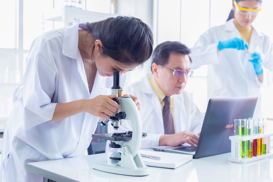 Life sciences professionals collaborating on a research project in a lab setting.