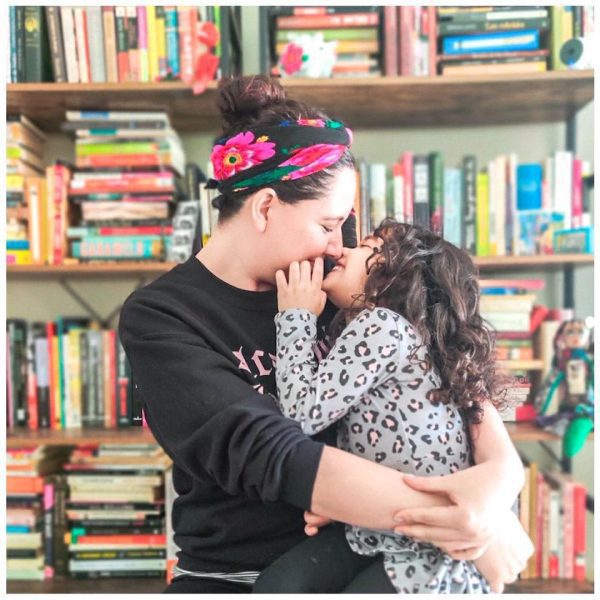 Maricela and her daughter at a library.