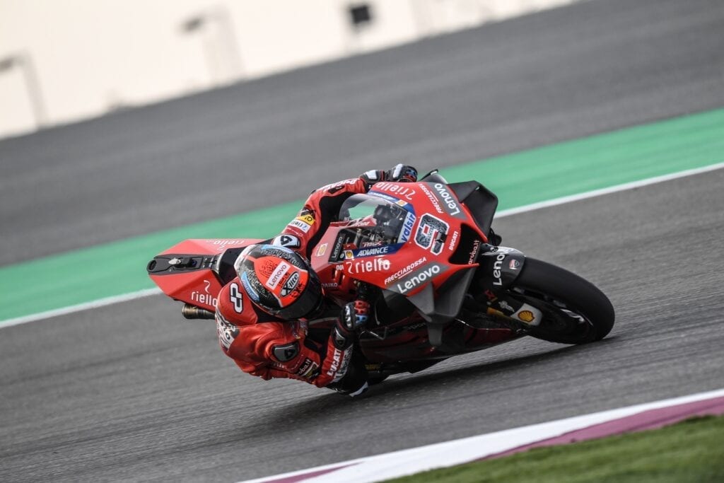 MotoGP bike taking a tight turn on the track