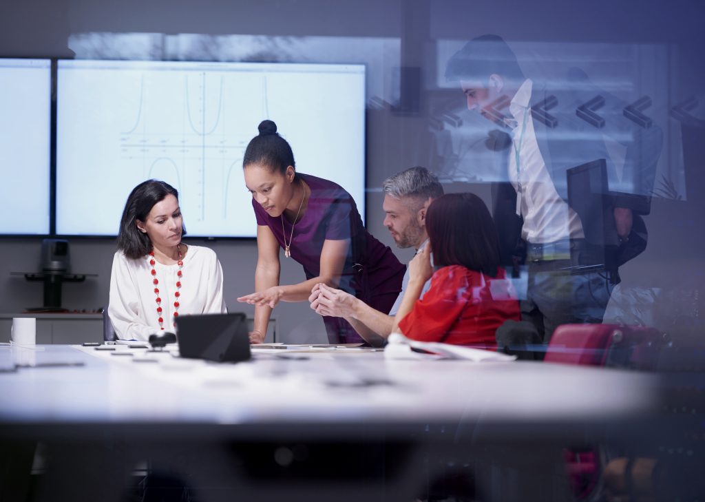 brand image - Diverse group of a team of co-workers having a meeting in a conference room.