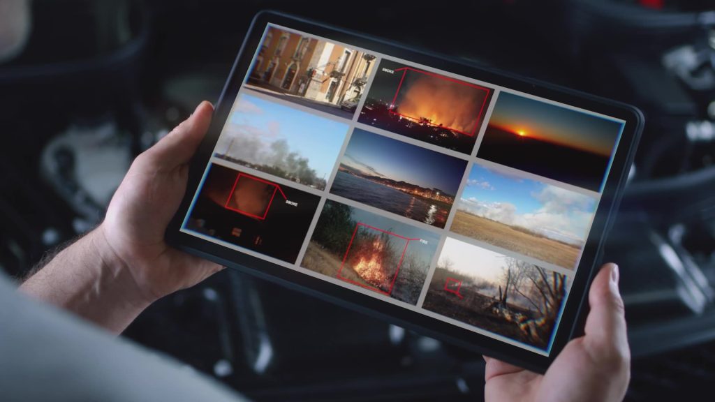 Someone reviewing data / images on a tablet screen.
