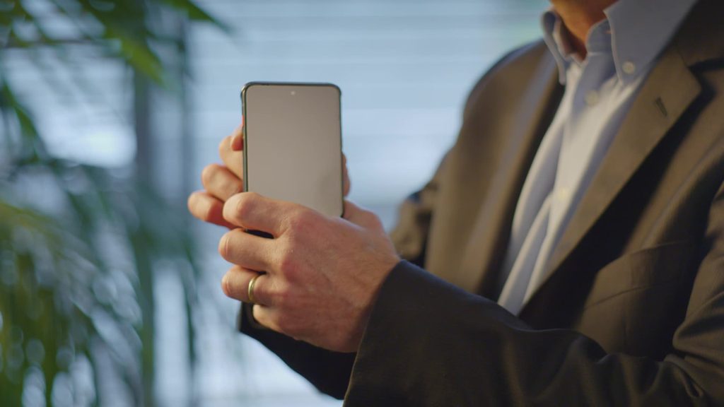 Someone holding a smartphone.