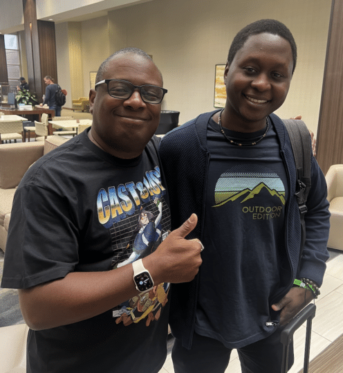 Photo of Frederick L. Jones, founder of Saturday AM and Issaka Galadima, artist of Clock Striker