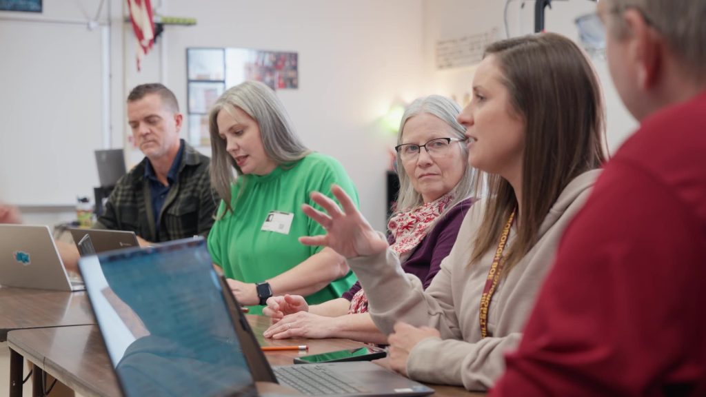 Educators discussing technology