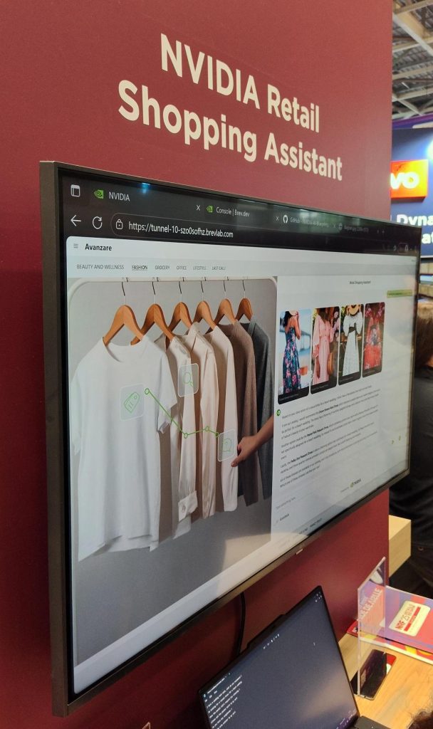 Large screen showing shirts hanging up and software for retailers