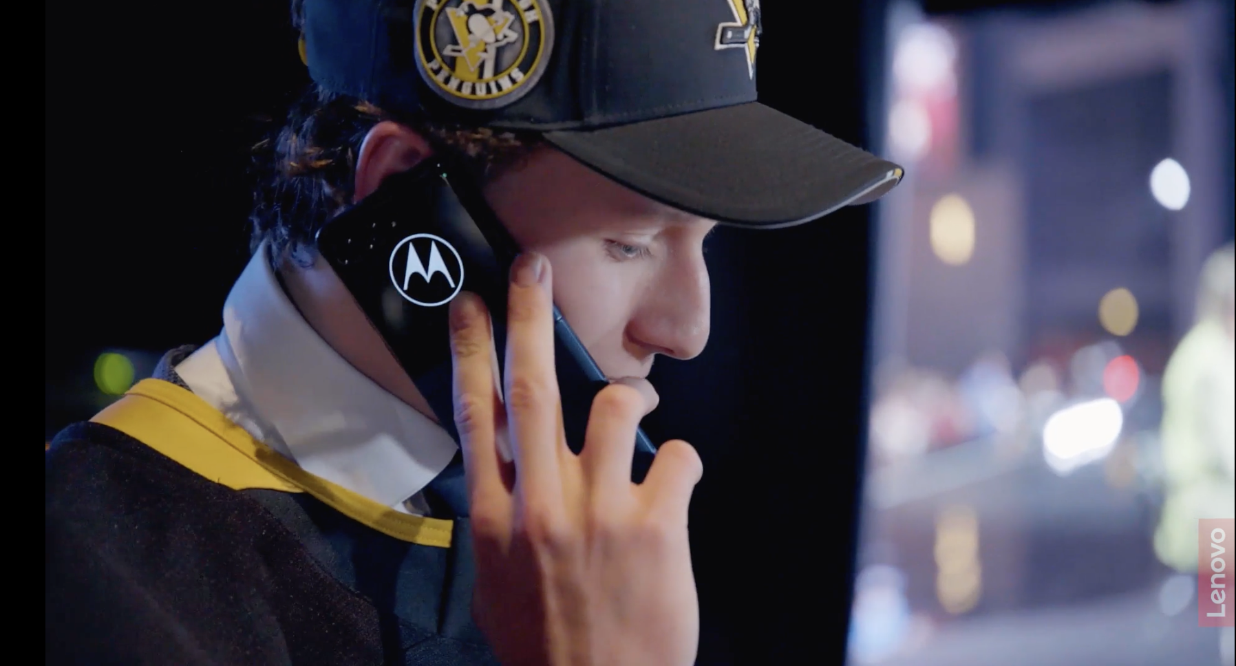 Penguins employee on moto phone