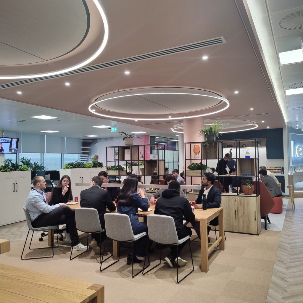 Lenovo employees sat around desks in the open plan office space